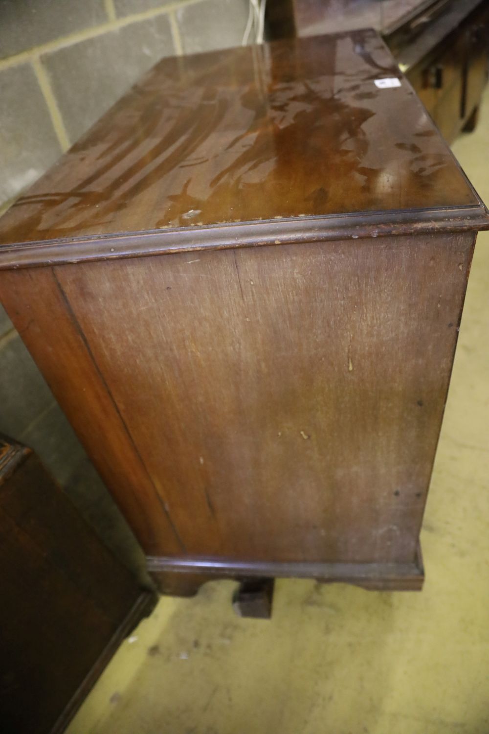 An Edwardian George III style mahogany chest, with brushing slide and three drawers, width 94cm